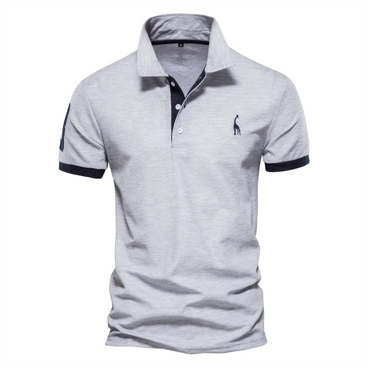 Light gray short-sleeved polo shirt with navy collar and sleeve trim
