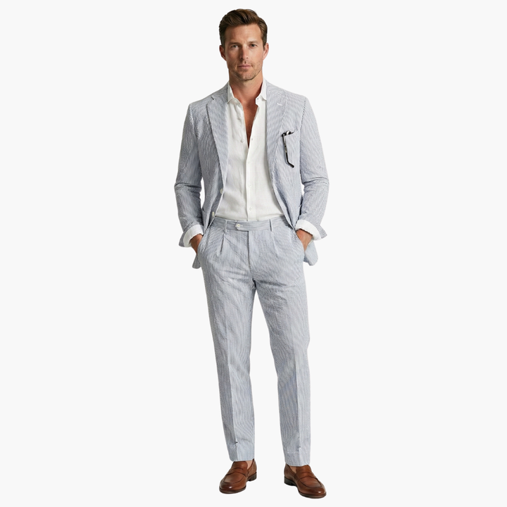 Gray pinstripe suit with hands in pockets showing trouser fit