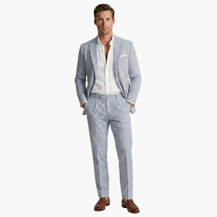 Gray pinstripe two-piece suit with white dress shirt and brown loafers