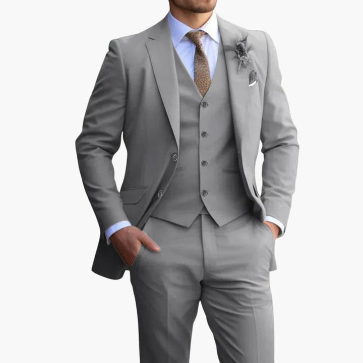 Gray three-piece formal suit with vest and notched lapel jacket on model