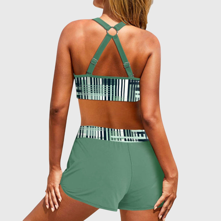 Back view of green high-waisted bikini with geometric stripe pattern and strappy design