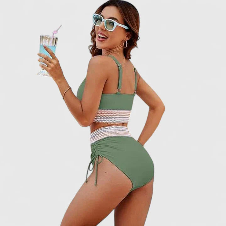 Green halter bikini with high-waisted bottoms and striped waistband detail