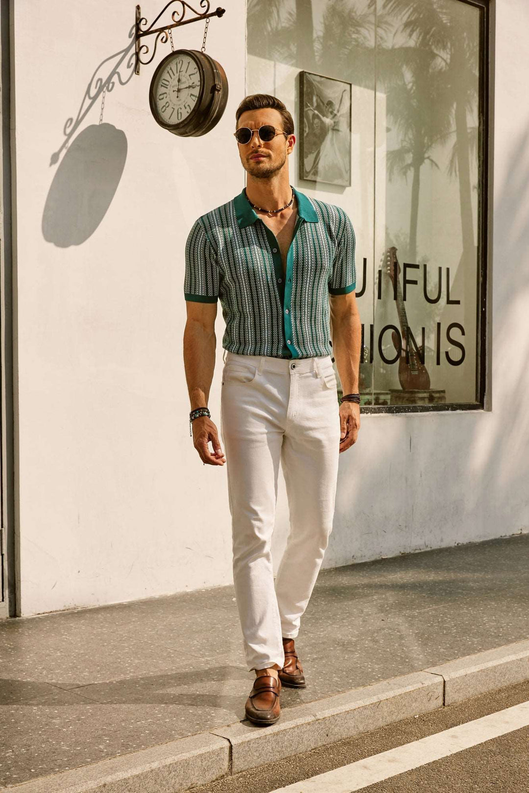 Green and cream striped polo shirt with teal trim, full length standing pose