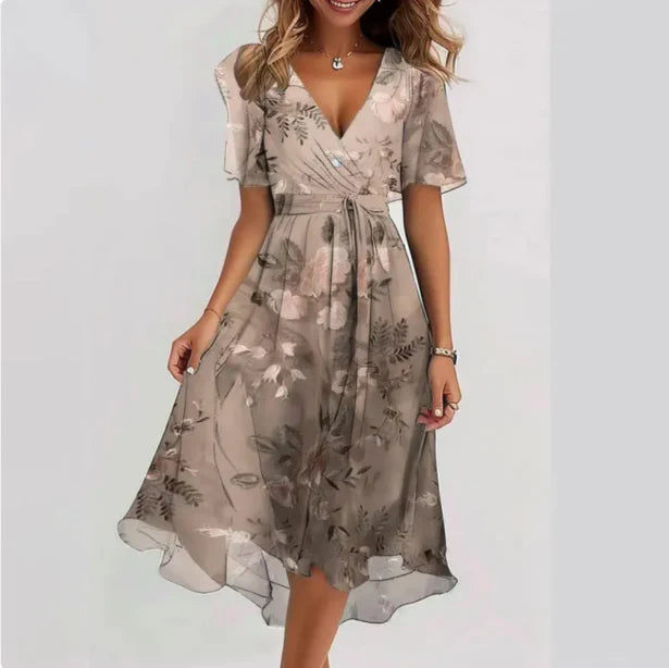Women beige floral midi wrap dress with V-neckline, short sleeves, and flowing skirt