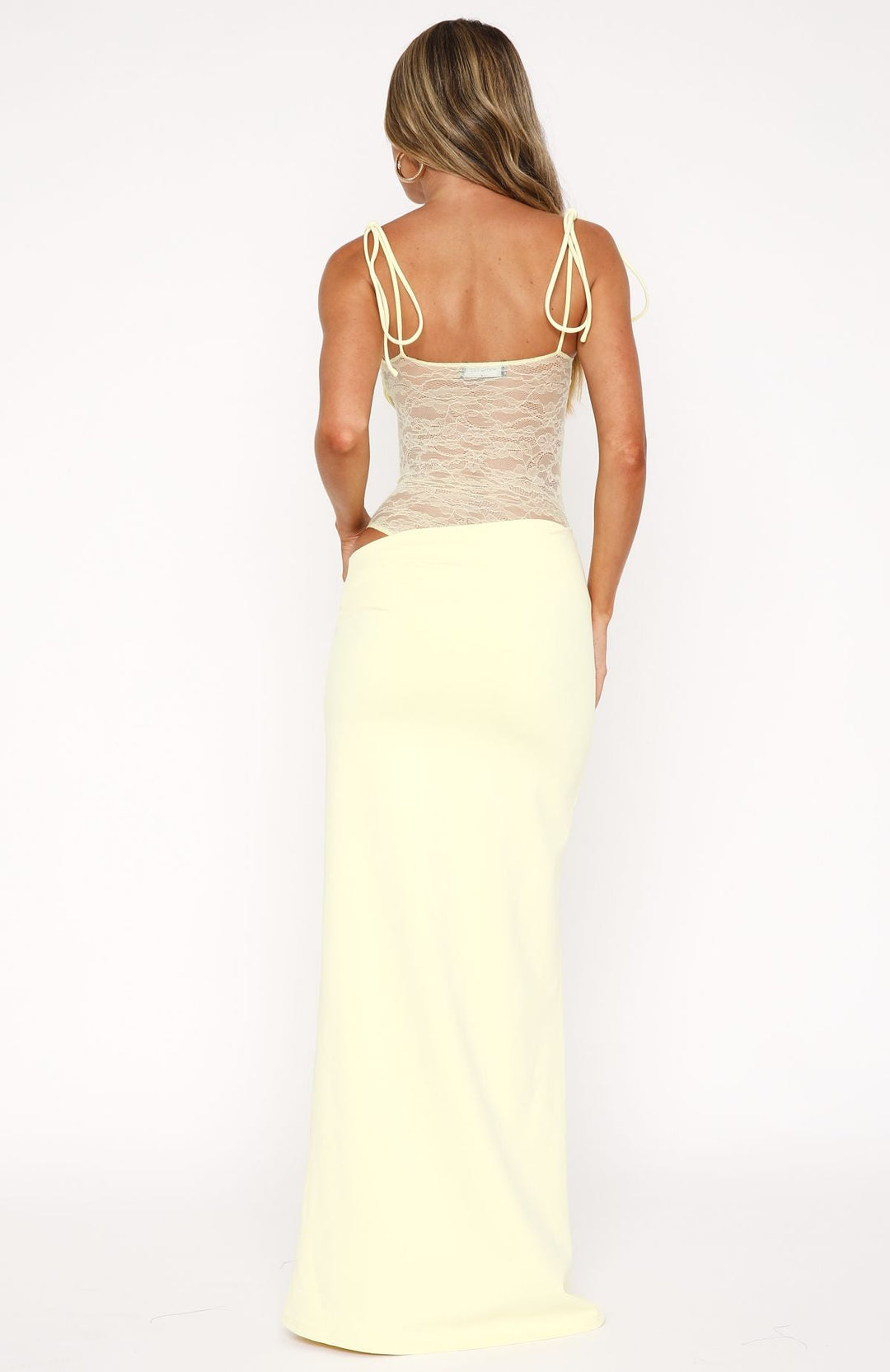 Women light yellow sleeveless maxi dress with lace panel bodice and tie straps, back view.