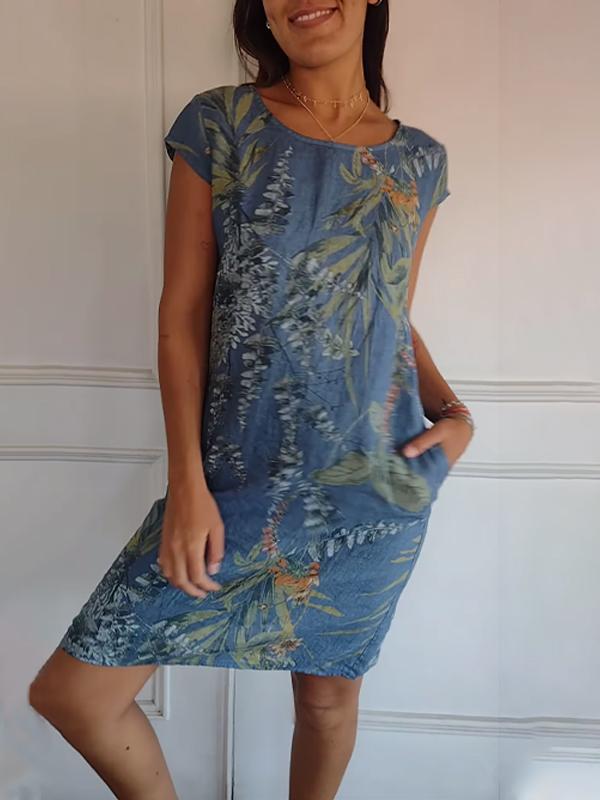 Women's blue green leaf print midi dress with short sleeves and scoop neckline, side view