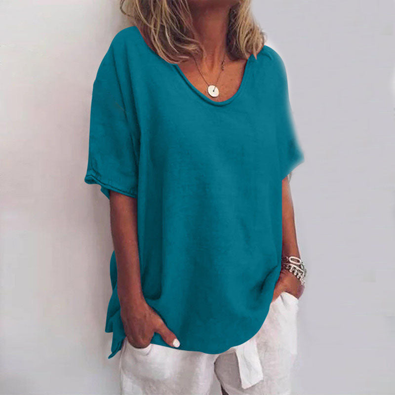 Women teal loose fit V neck t-shirt featuring raw-edge neckline, front view.