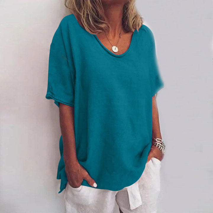 Women teal loose fit V neck t-shirt featuring raw-edge neckline, front view.