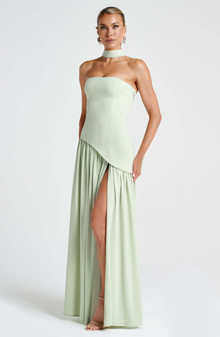 Women light green strapless maxi dress featuring asymmetrical draped skirt and high side split.