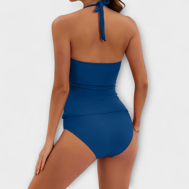 Back view of navy blue halter swimsuit with tied halter closure