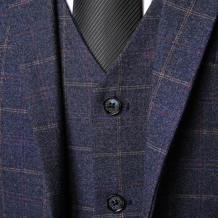 Navy plaid vest detail showing button closure and tailored fit