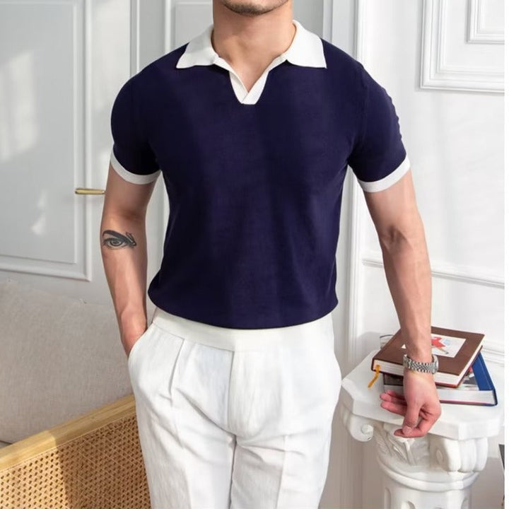 Navy short sleeve polo shirt with white ribbed cuffs and collar, regular fit front view