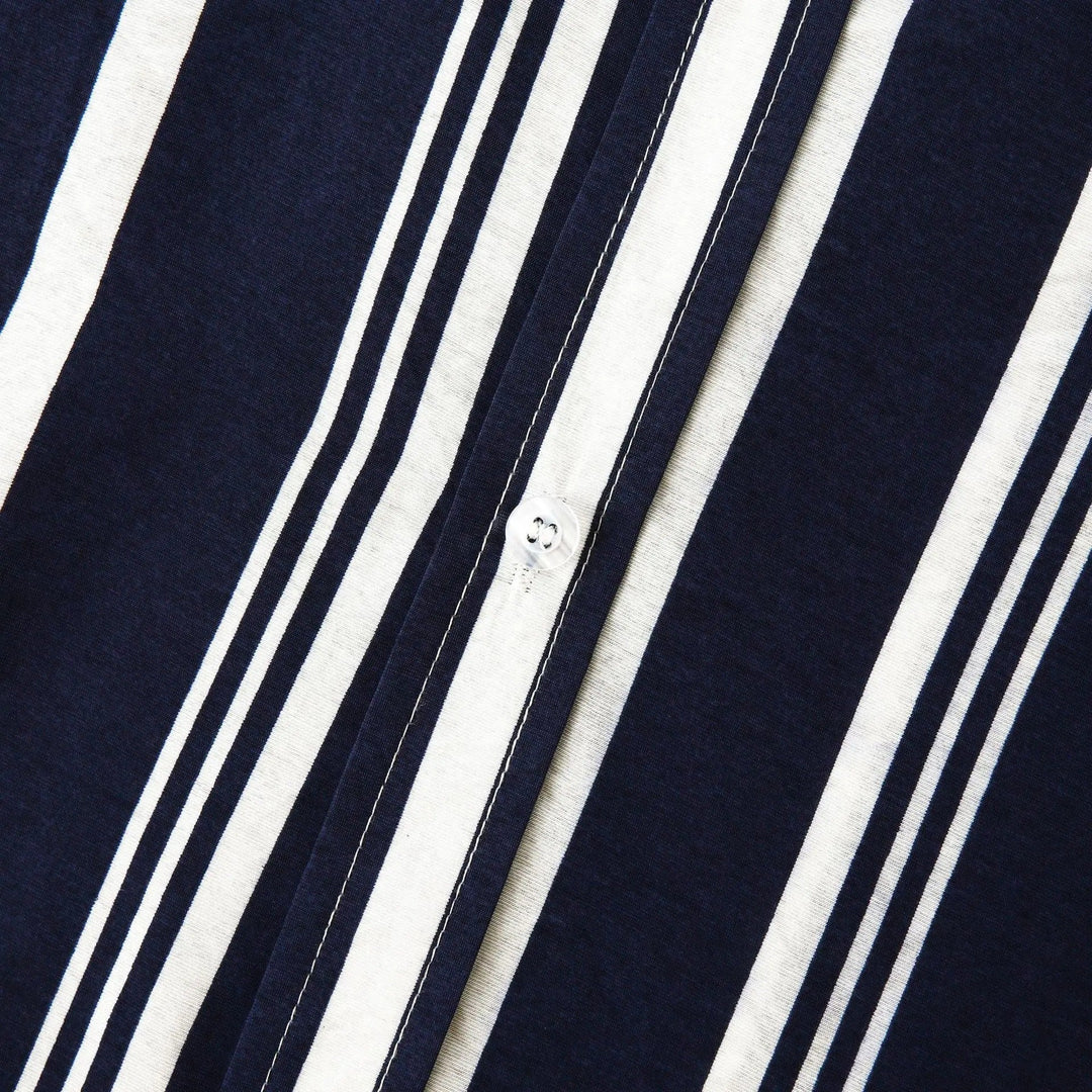 Button placket and collar detail on navy striped short sleeve shirt