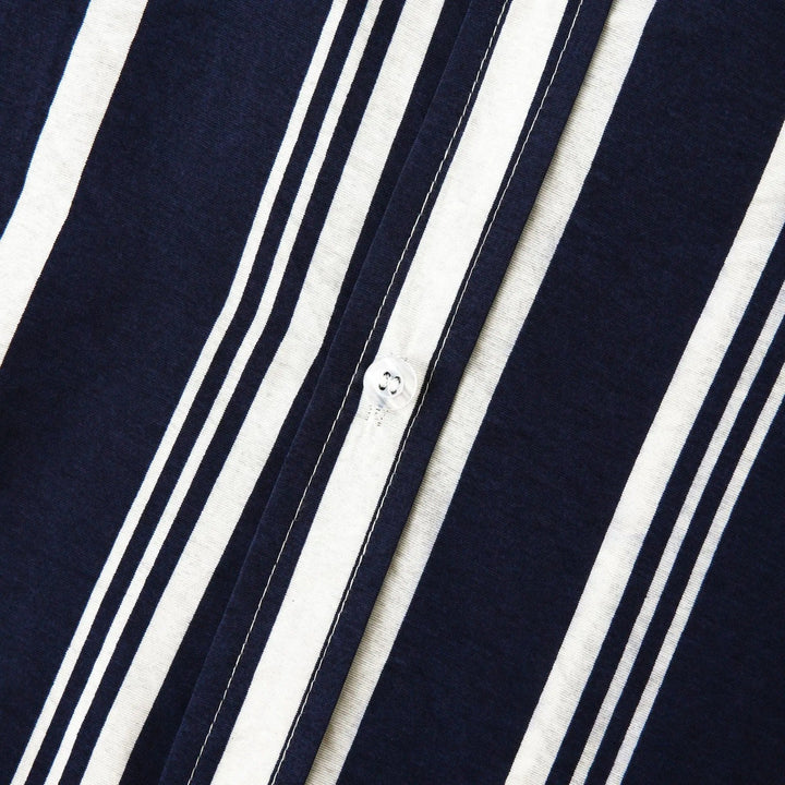 Button placket and collar detail on navy striped short sleeve shirt