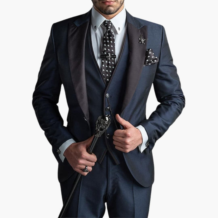Navy blue three-piece suit with contrasting black vest and polka dot tie