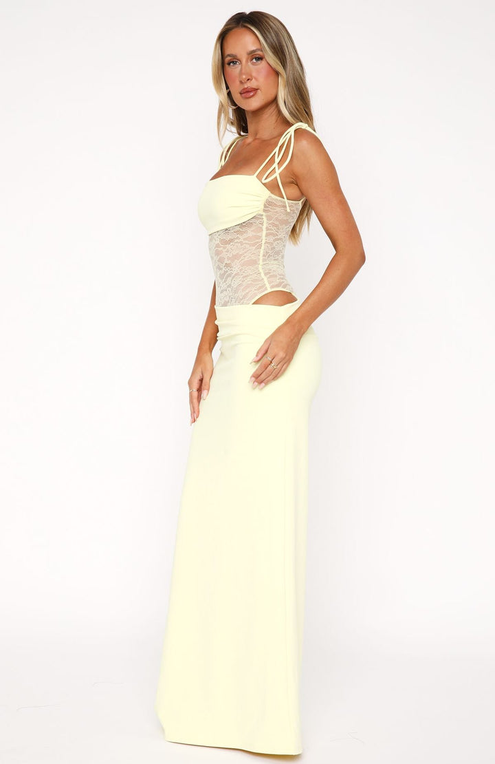 Women light yellow sleeveless maxi dress with lace detail on the side view.