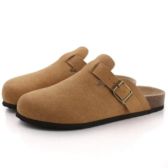 Pair of brown suede-like cork buckle slide slippers with dark soles, side view