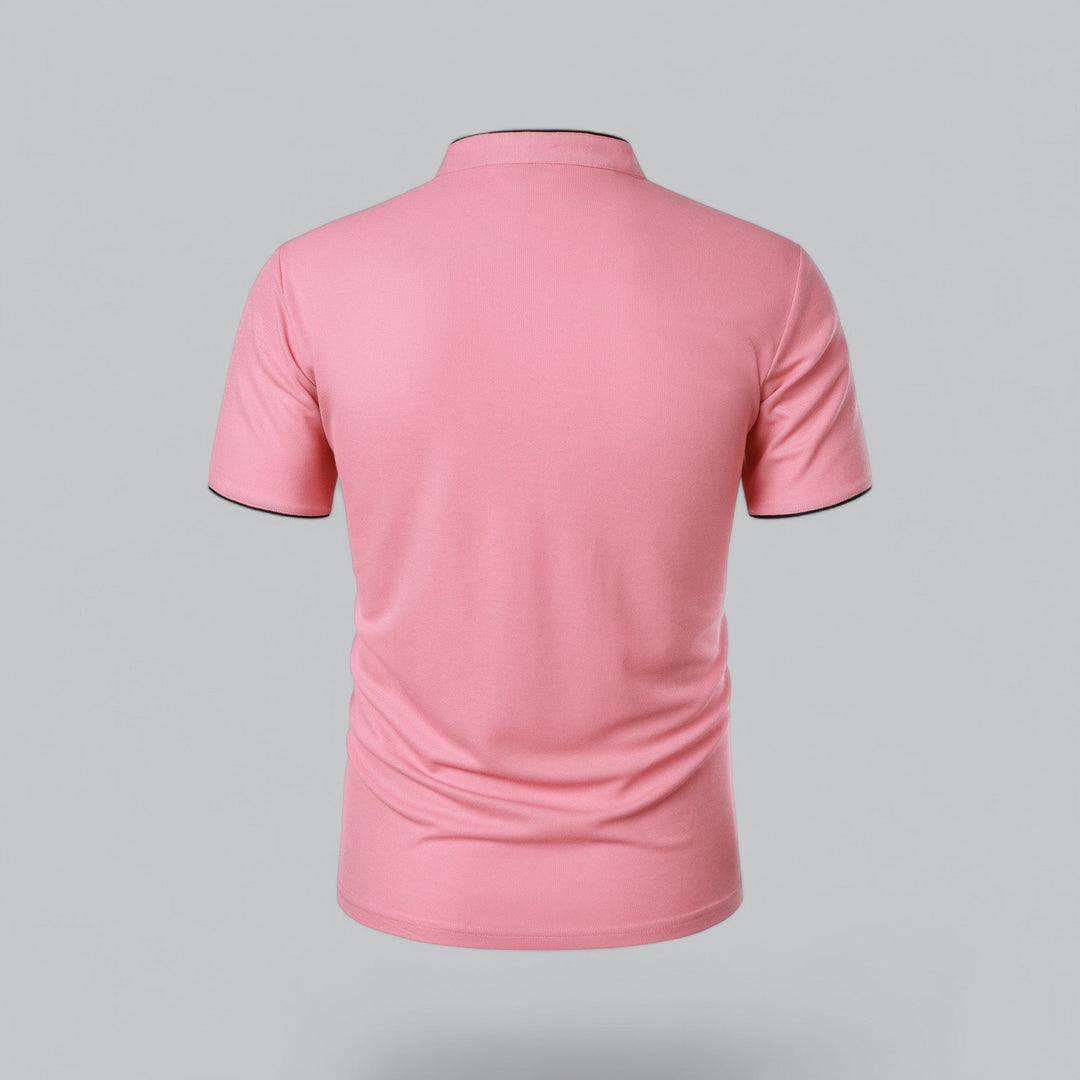 Pink polo shirt back view with navy trim accent