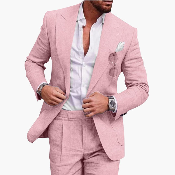 Pink tailored two-piece business suit with white dress shirt and pocket square