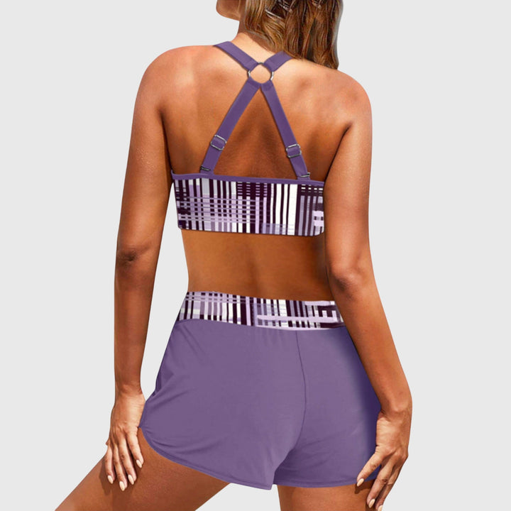 Back view of purple high-waisted bikini with geometric stripe pattern and strappy design