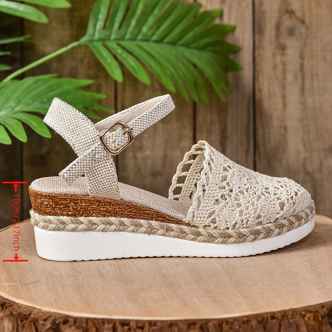Cream crochet lace espadrille sandal with buckle ankle strap and white platform sole, side view