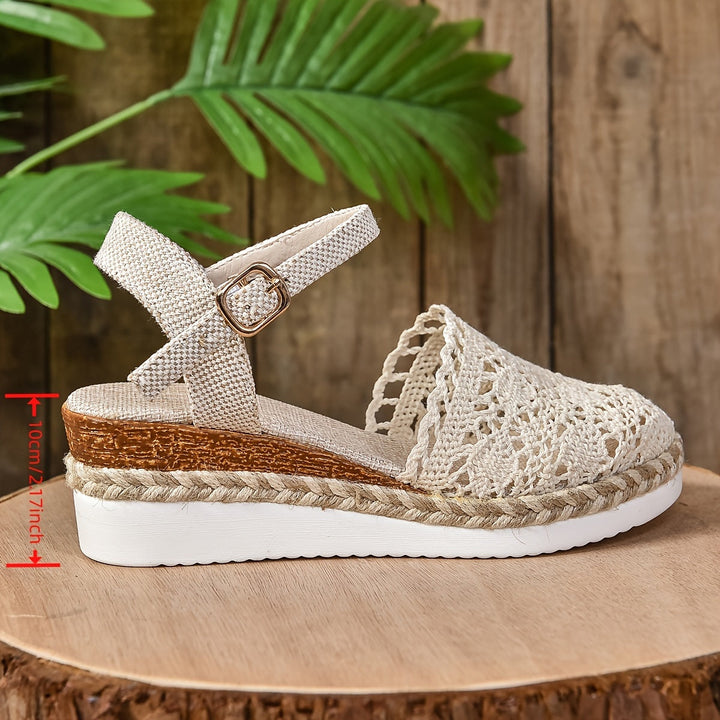 Cream crochet lace espadrille sandal with buckle ankle strap and white platform sole, side view
