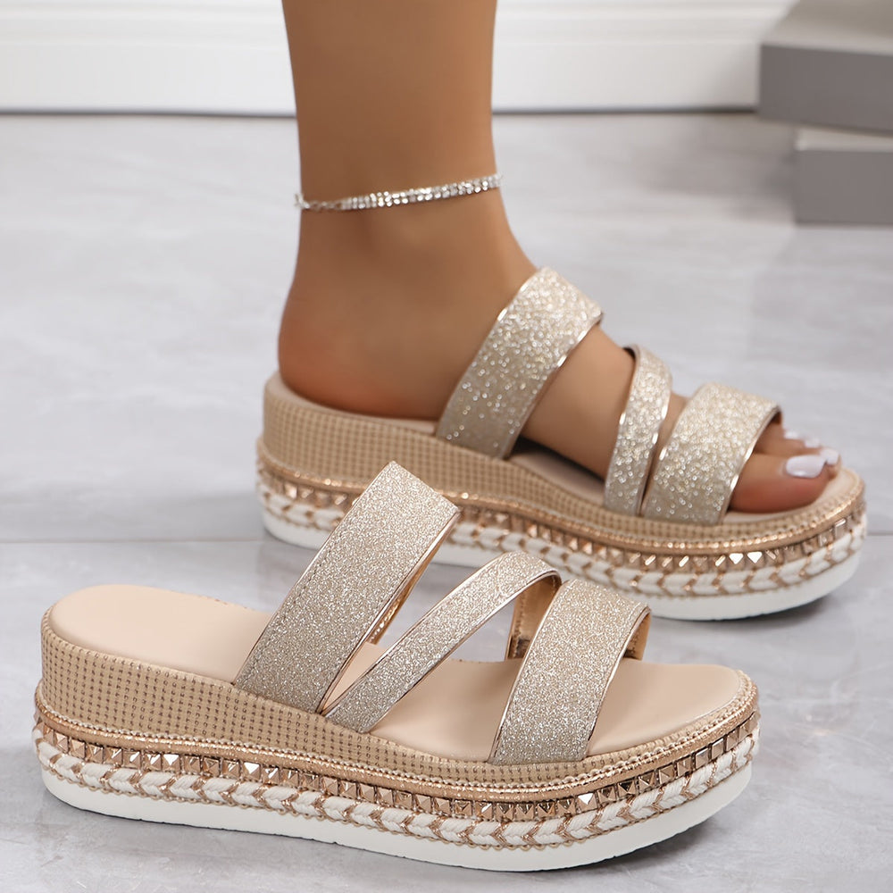Pair of champagne sparkle platform slides with three glitter straps and textured sole