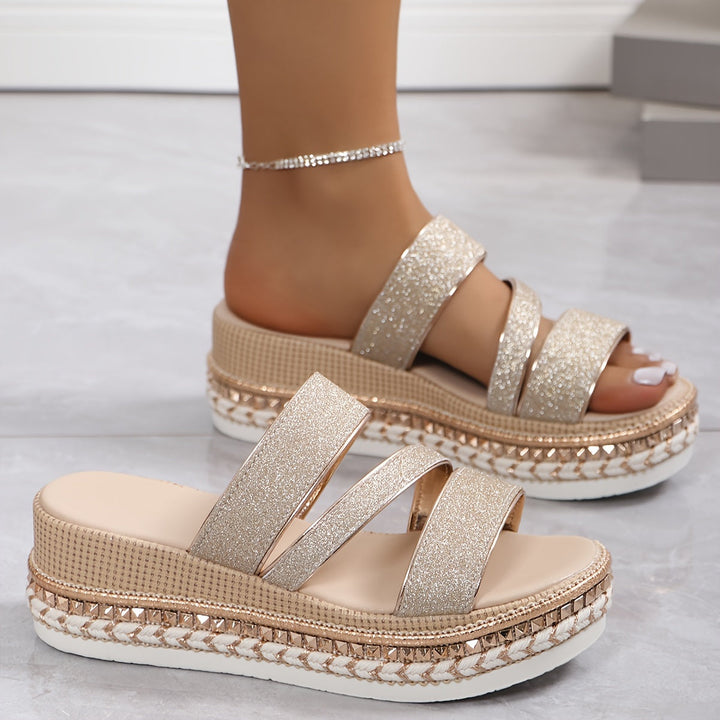 Pair of champagne sparkle platform slides with three glitter straps and textured sole