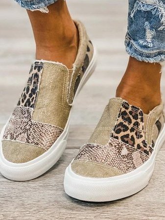 Mixed leopard print canvas slip-on sneakers worn with rolled denim cuffs