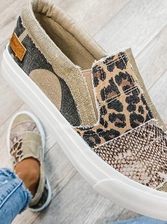 Canvas slip-on sneaker interior showing beige lining and mixed print design
