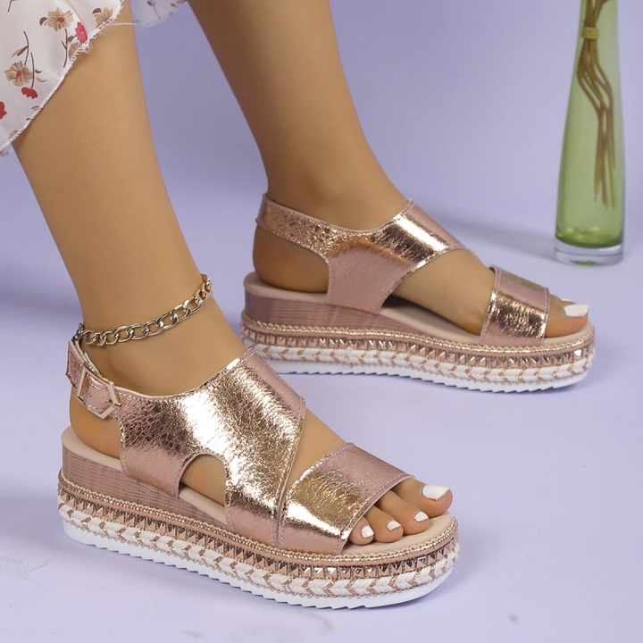 Rose gold metallic platform sandals with chain ankle strap and cushioned sole