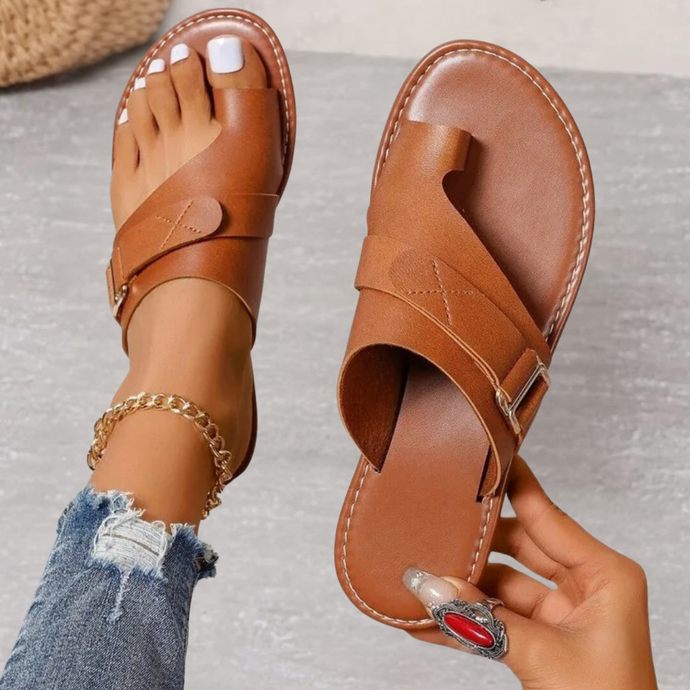 Tan leather orthopedic cross strap sandal with contoured footbed and metal buckle