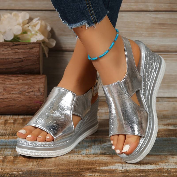 Silver metallic peep toe platform sandal with white sole and textured wedge