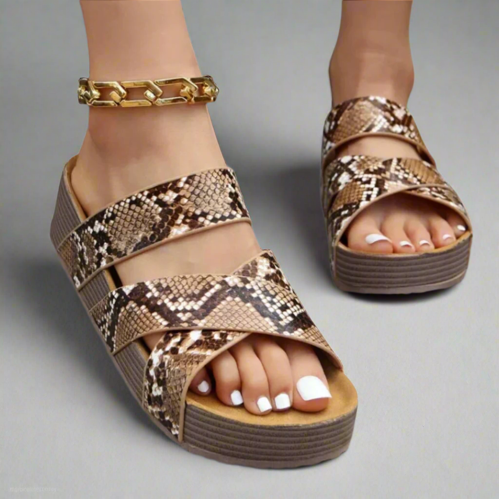 Snakeskin print crossover strap platform sandal with gold chain ankle bracelet