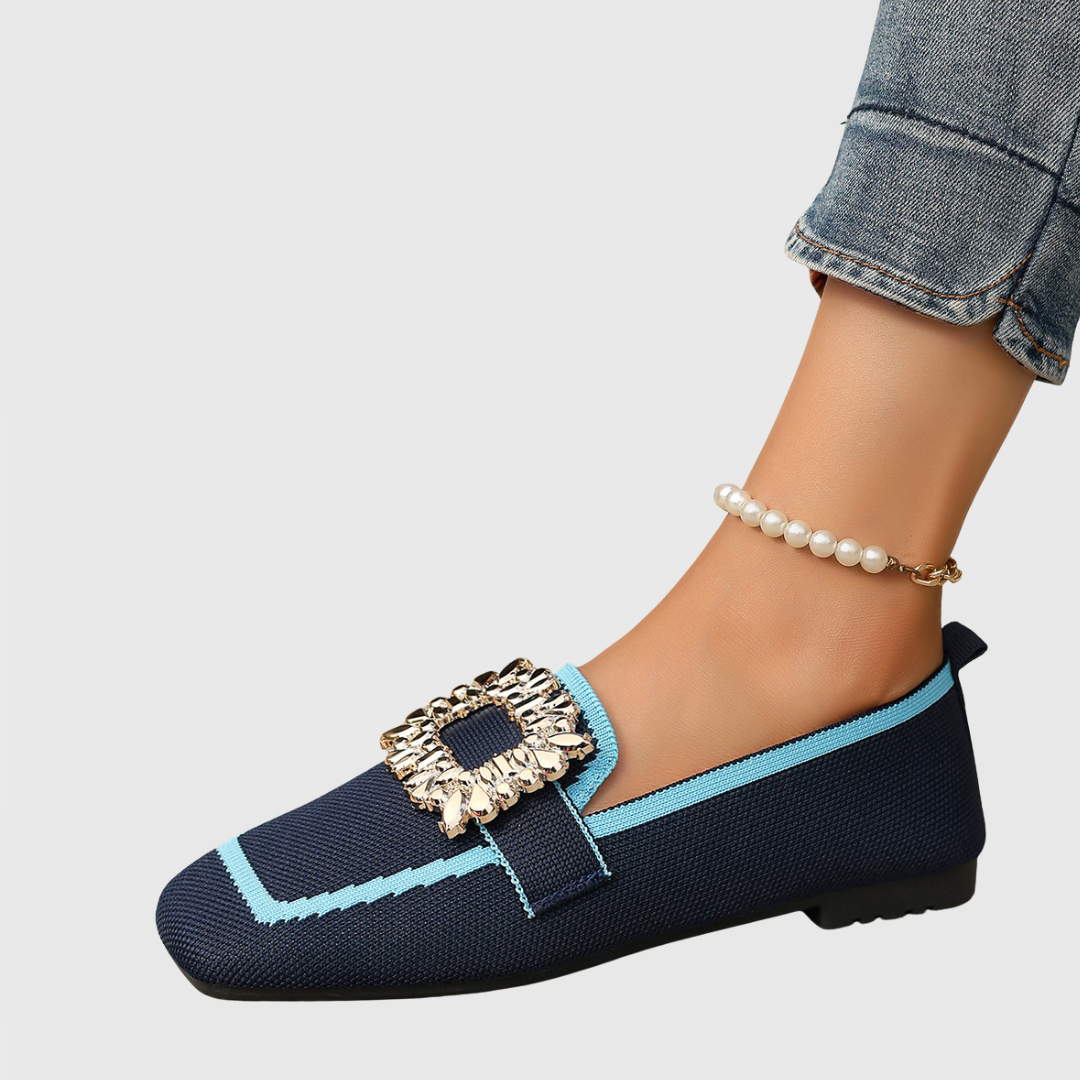 Navy loafer with turquoise trim, cream ruffled bow, worn with pearl anklet