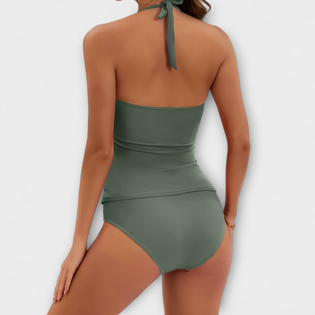 Back view of sage green halter swimsuit with tied neck closure