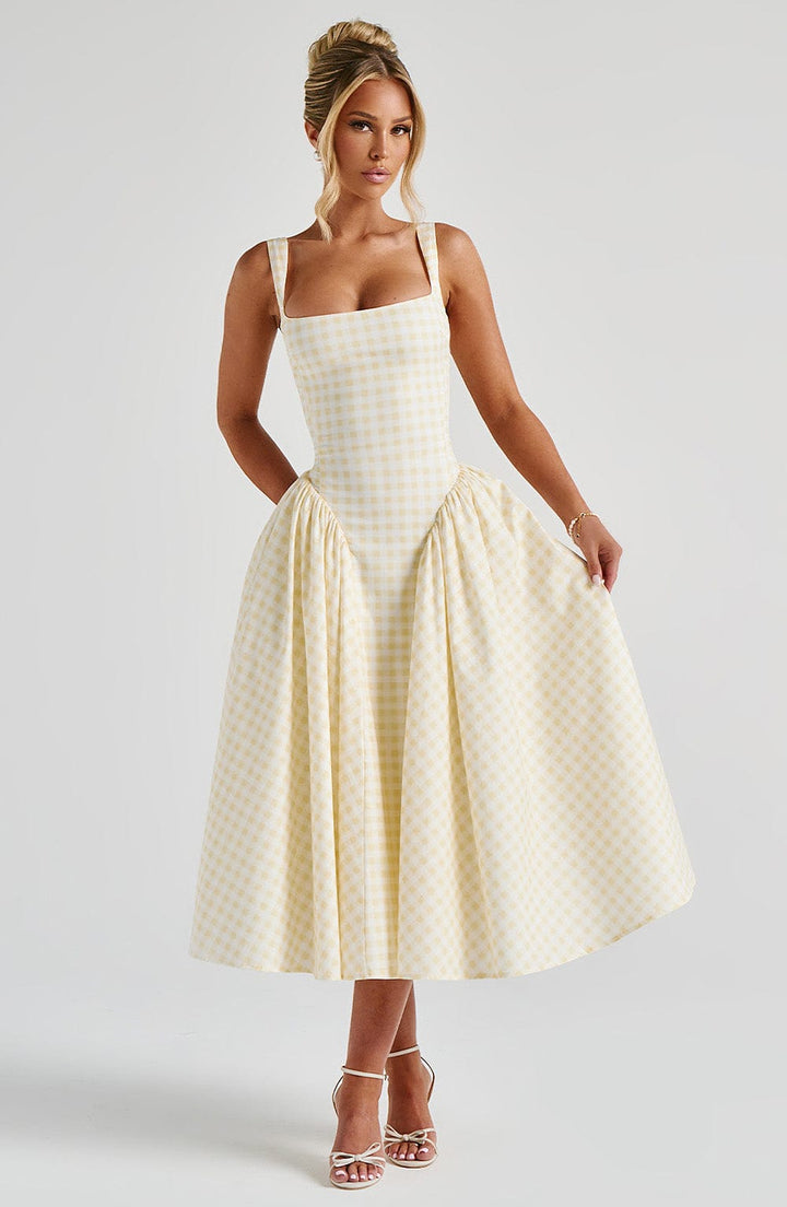 Women yellow gingham midi dress with hands in pockets and voluminous skirt