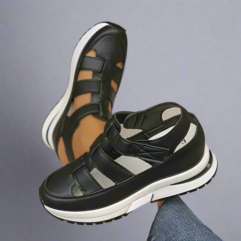 Women black platform cutout sneakers with hook-and-loop straps, top and side view