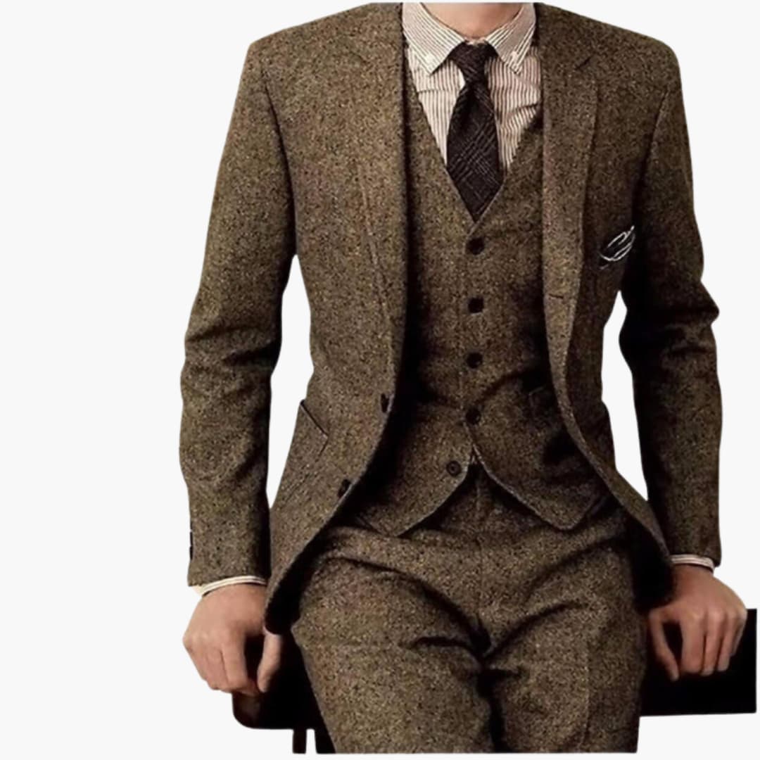 Men's tan herringbone three-piece formal wedding suit with notch lapel blazer, vest, and tailored pants, front view