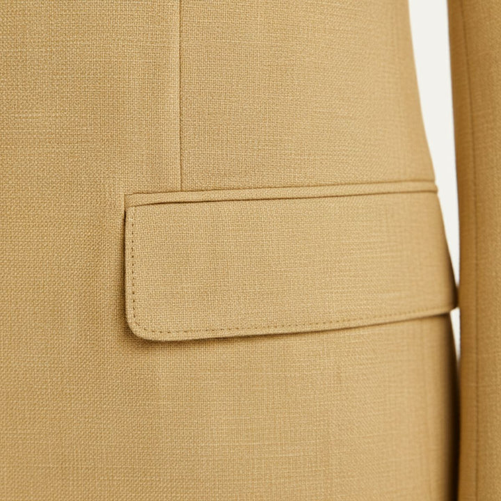 Tan linen blazer pocket detail showing tailored welt pocket on jacket