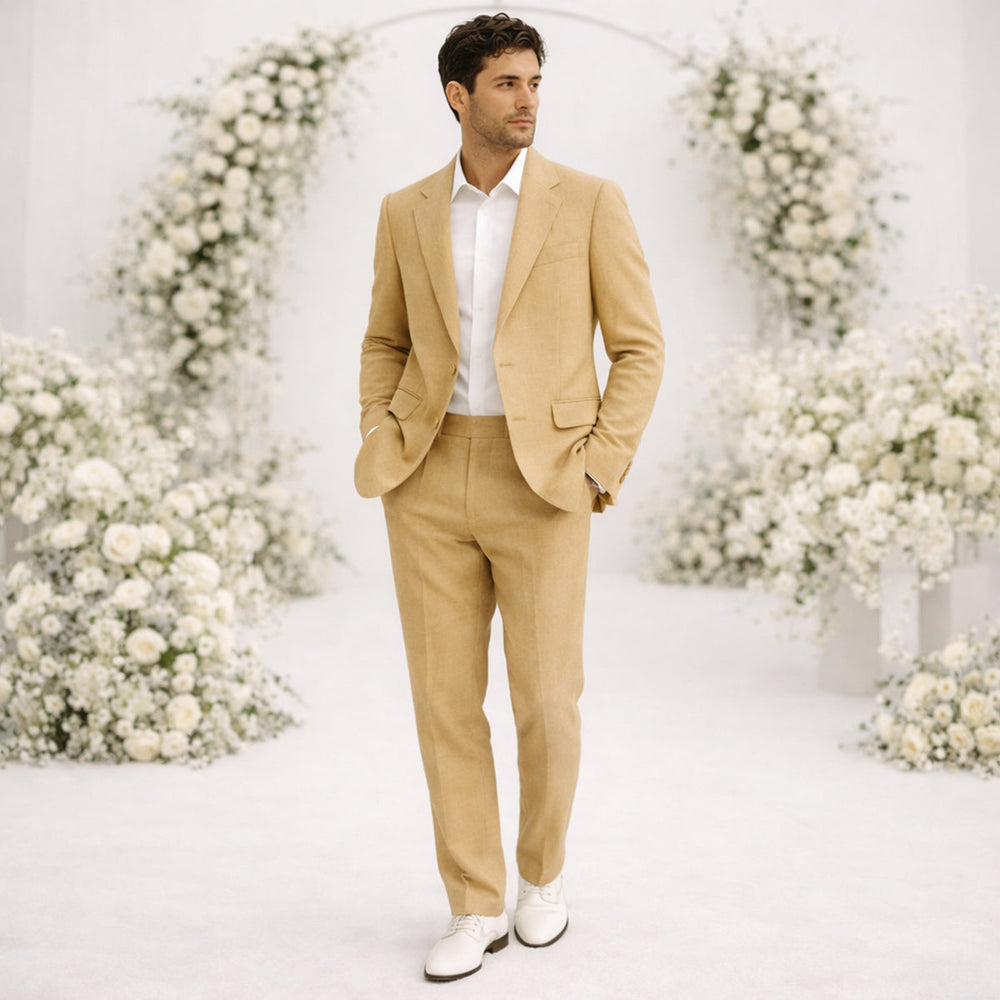 Tan linen suit man with white dress shirt in formal wedding setting