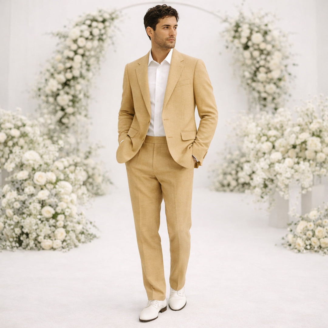 Tan linen suit man with white dress shirt in formal wedding setting