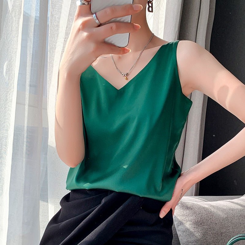 Women green sleeveless metallic knit V-neck top with layered necklaces