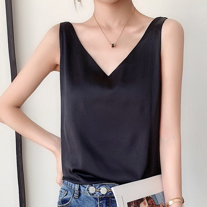 Women black sleeveless metallic knit V-neck top with minimal styled jewelry