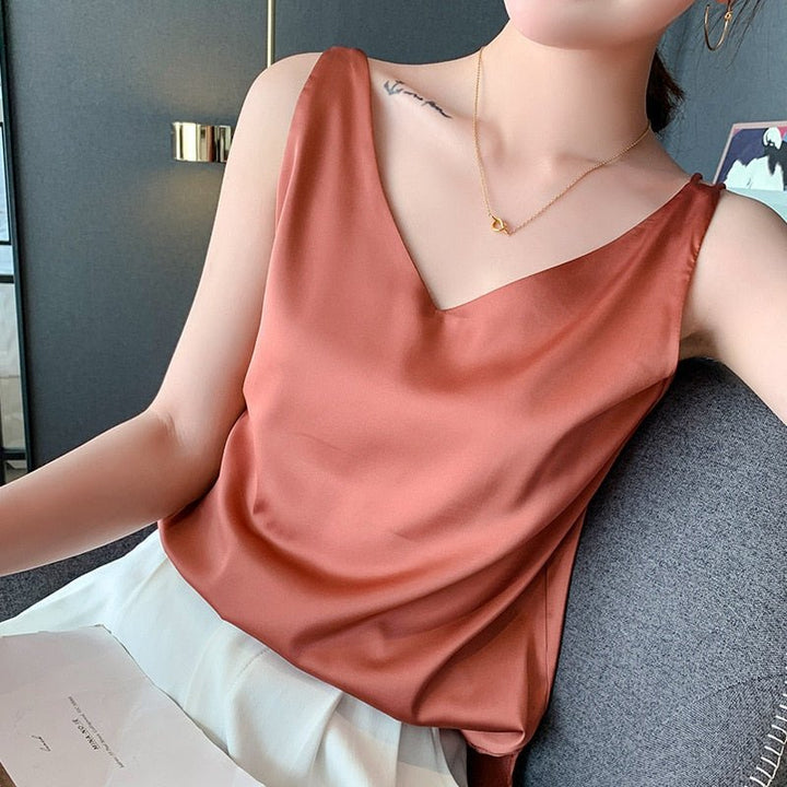 Women burnt orange sleeveless metallic knit V-neck top close-up