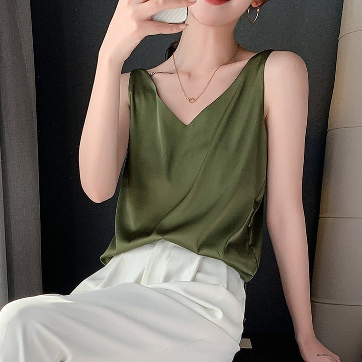 Women olive sleeveless metallic knit V-neck top with white pants
