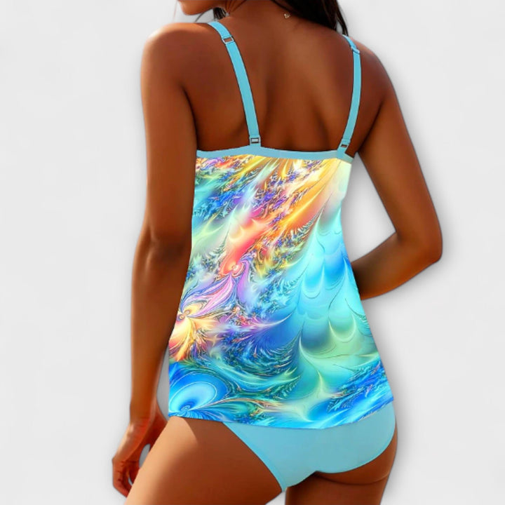 Back view of colorful printed tankini swimsuit with turquoise straps and solid turquoise bottoms