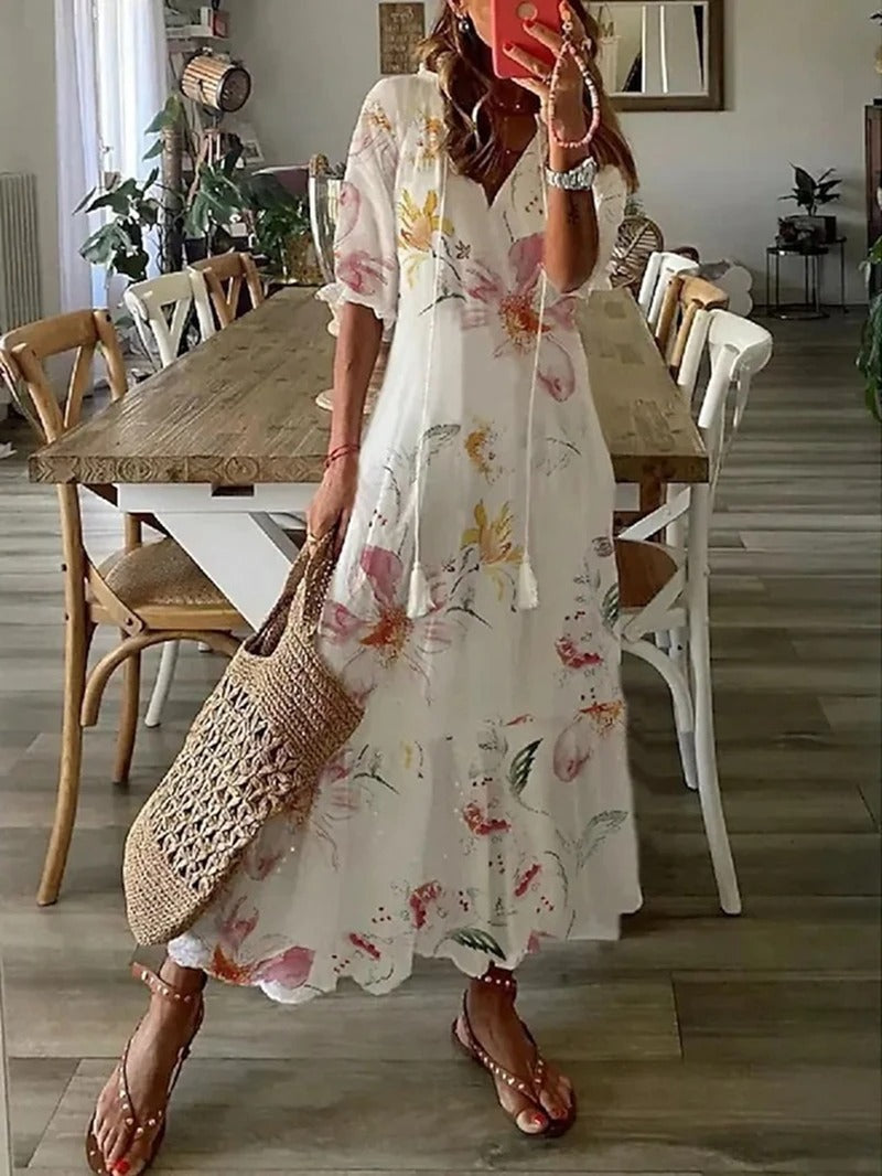 Women white floral printed maxi dress with V-neck and short sleeves, full-body view indoors