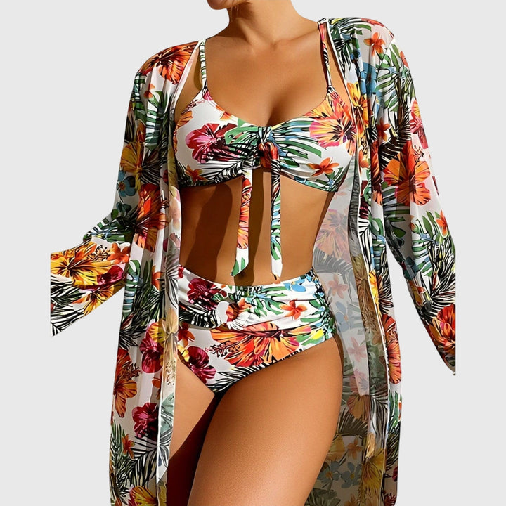 White tropical floral bikini with ruched top, high-waist bottoms, and long-sleeve cover-up robe