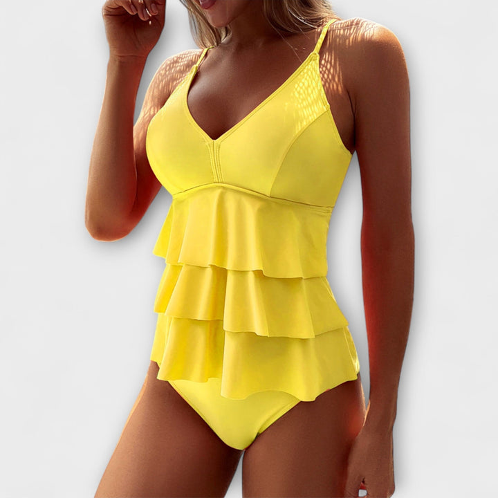 Yellow ruffled v-neck one-piece swimsuit with layered ruffle skirt design